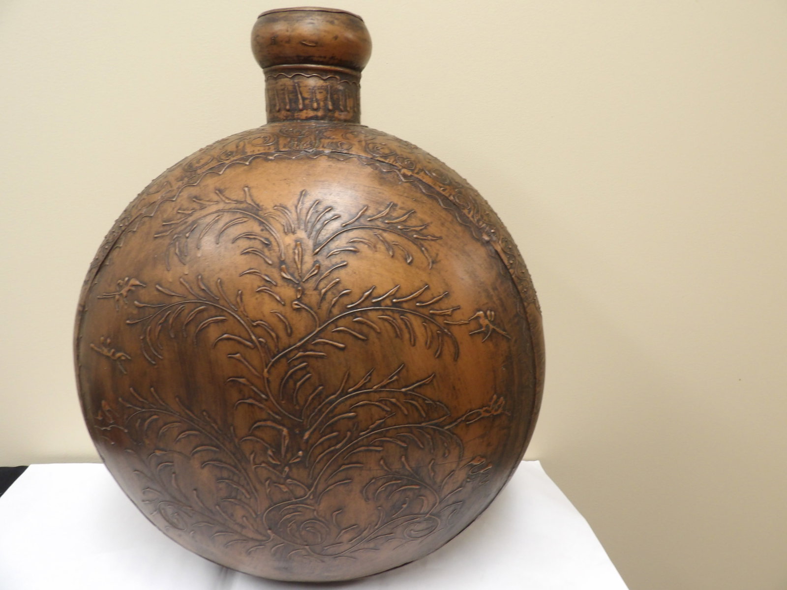 large antique Tibetan copper vessel with floral pattern 1920s: 23 inches height.