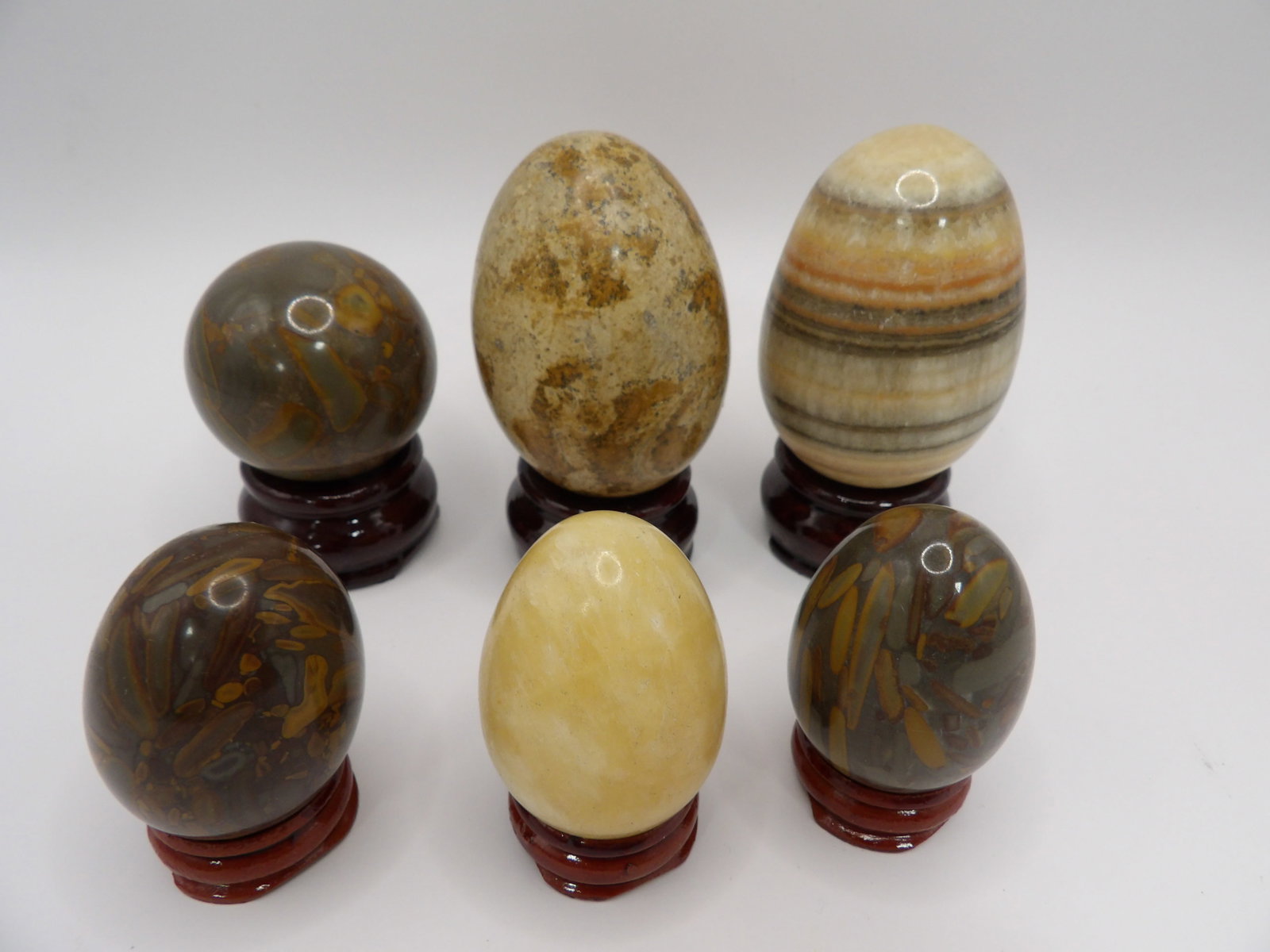 Lot of 6 Chinese gem stone cut eggs with bases: The tallest egg is approx. 3 inches height.