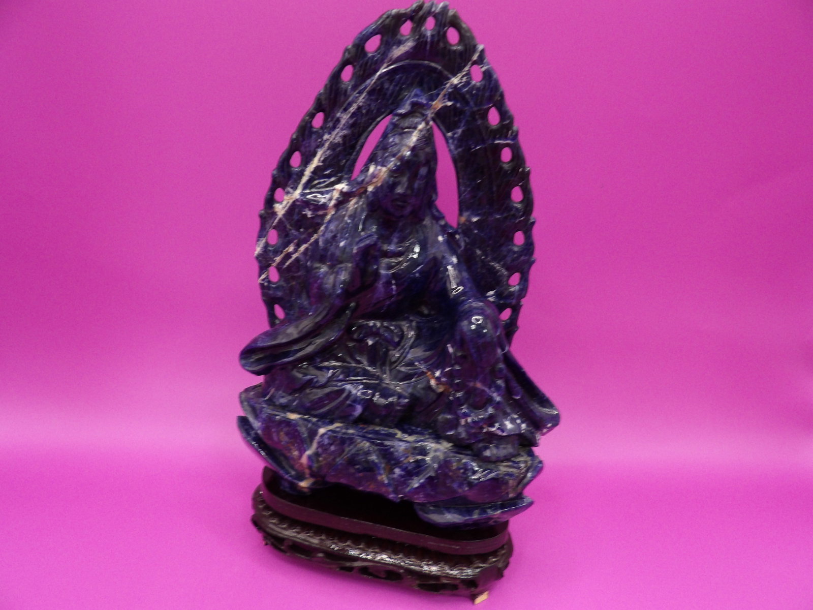 Chinese lapis lazuli Kwan Yin carving with custom wooden stand: Statue 7.3 inches height. With wooden base total height is 8.5 inches.