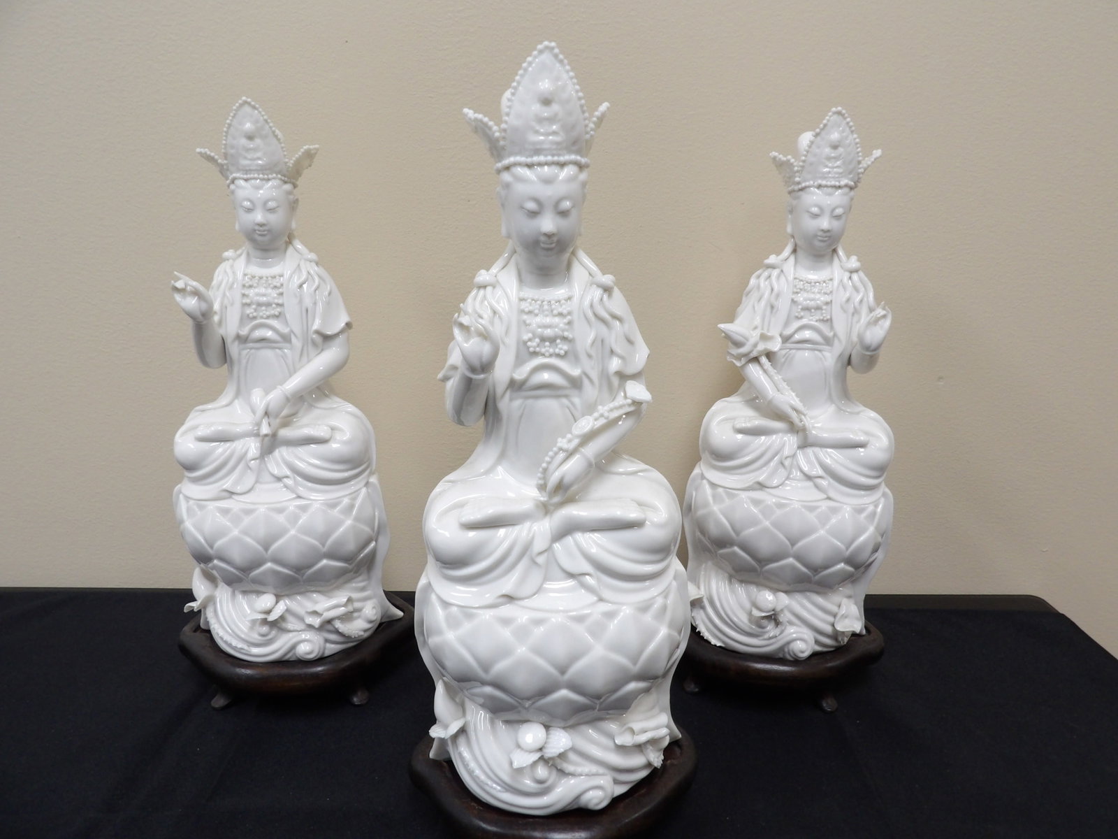 Lot of 3 Chinese Blanc De China Dehua porcelain Kwan Yin statue with wooden base: Tallest one is over 12 inches height. With wooden base all are over 13 inches height.