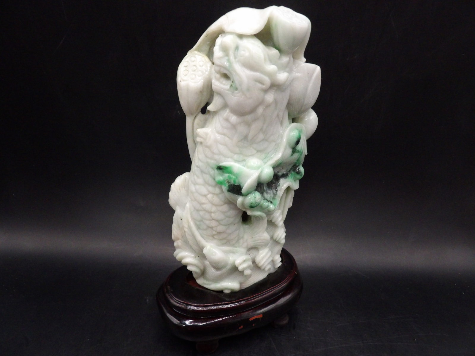 Chinese jadeite jade carving of double dragon fish with lotus pond scene: Jadeite statue is adhered to wooden base. Total height is 7.8 inches.