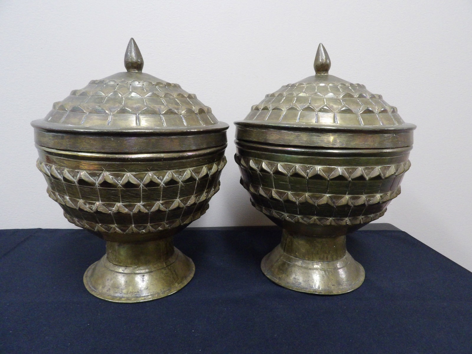 Lot of 2 antique ornate Asian lidded brass containers: Approx. 11 inches height.