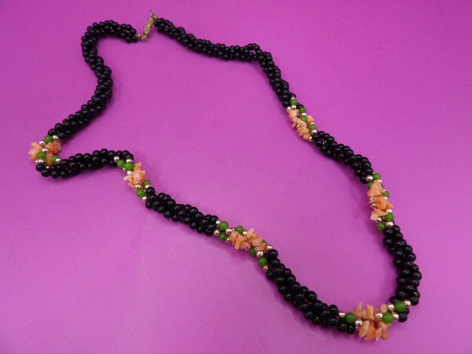 onyx angel skin coral green jade beaded 3-strand twisted necklace: 22 inches long.