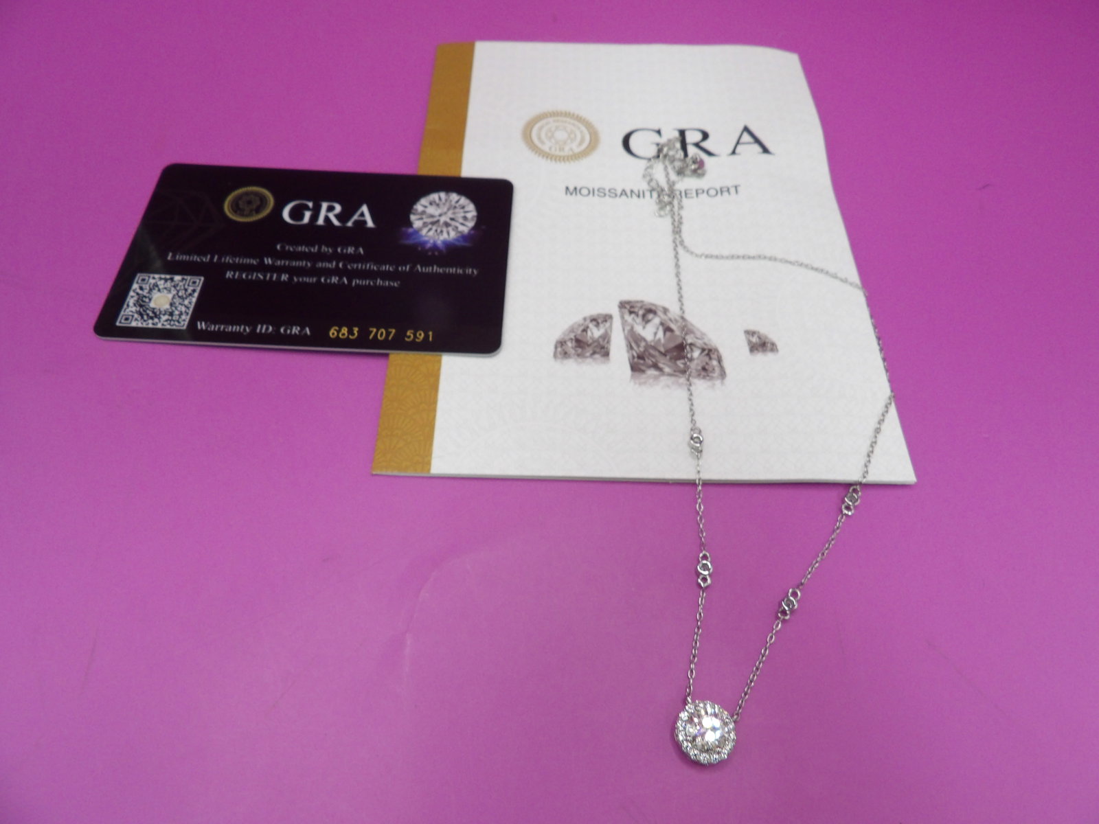 1 ct Moissanite halo sterling silver necklace marked 925 Italy: 16 inches necklace with 2 inches extender. Marked 925 Italy on the clasp.