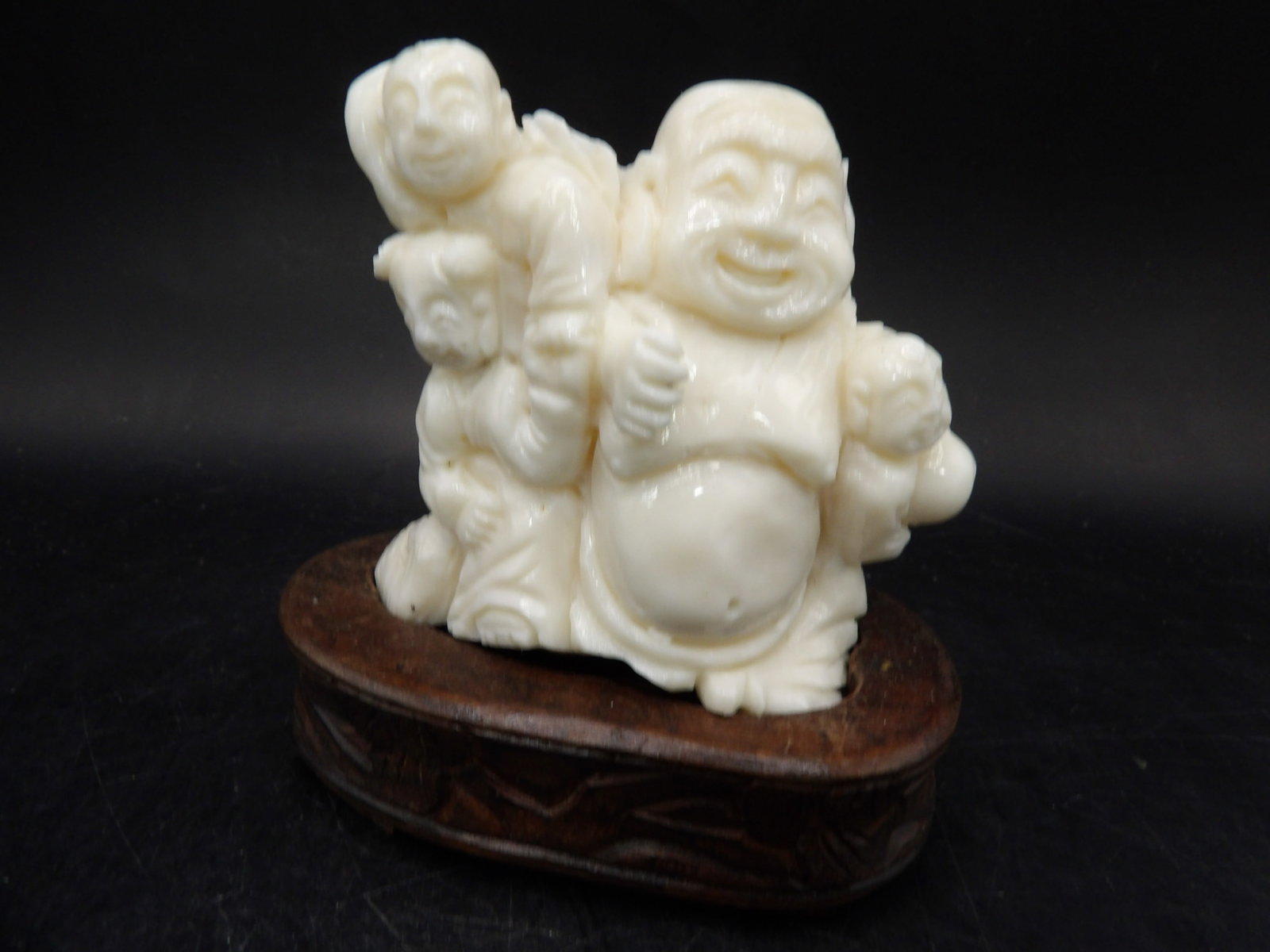 rare Chinese coral fine carved buddha and 3 boys group sculpture adhered on wooden base: 3.3 inches height including wooden base.