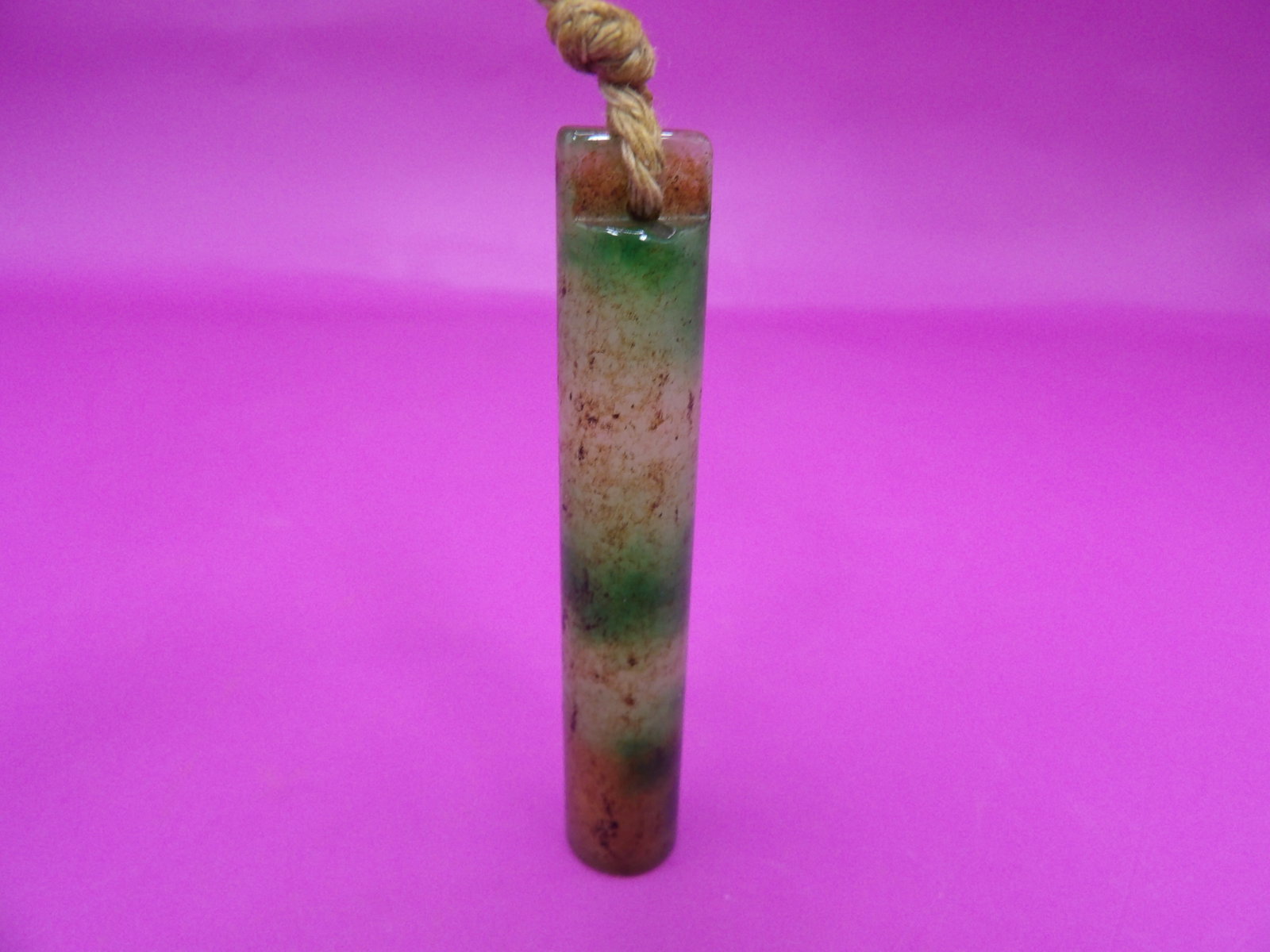 Chinese jadeite jade carved tube shaped pendant: 2.5 inches height. 13 grams.