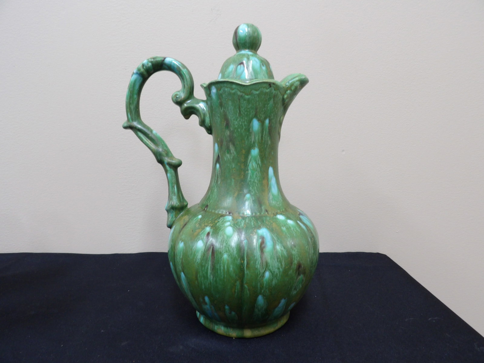 studio pottery lidded pitcher with green and turquoise drip glaze: 12 inches height.