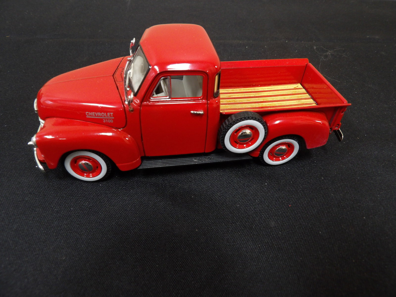 red 1953 Chevy 3100 pickup truck made exclusively for National Motor Museum: 6 inches length.