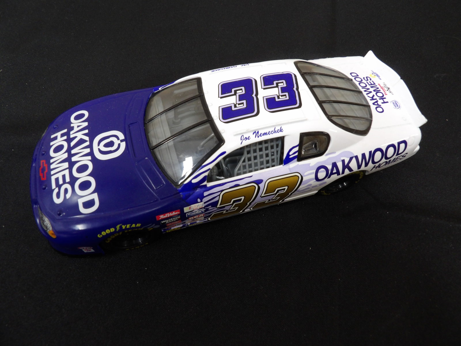 1:24 diecast model of Joe Nemechek's #33 Oakwood Homes Nascar car: 8 inches length.