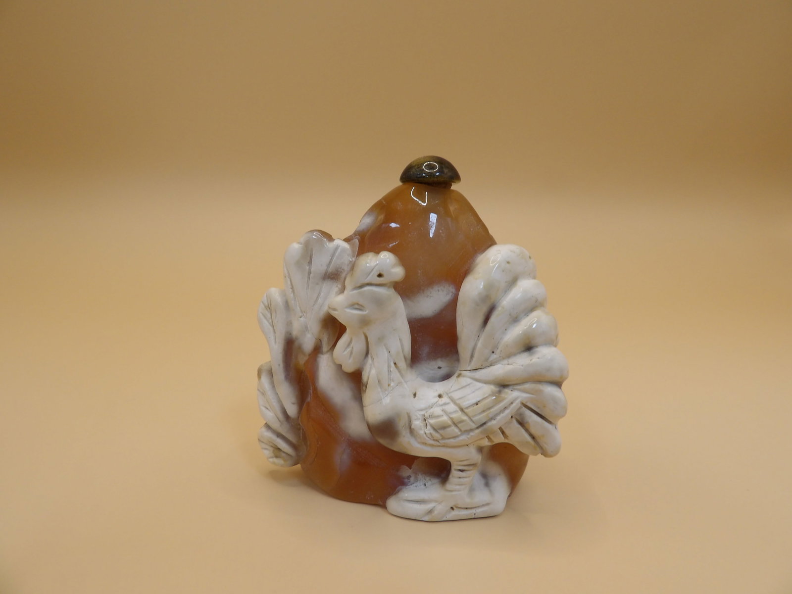 Chinese carved agate snuff bottle with raised rooster motif: 2 inches height.