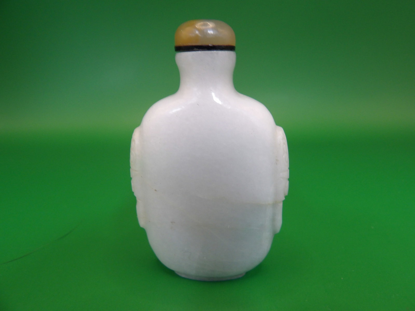 Chinese well hollowed jadeite jade snuff bottle with mask handles (1 of 6)