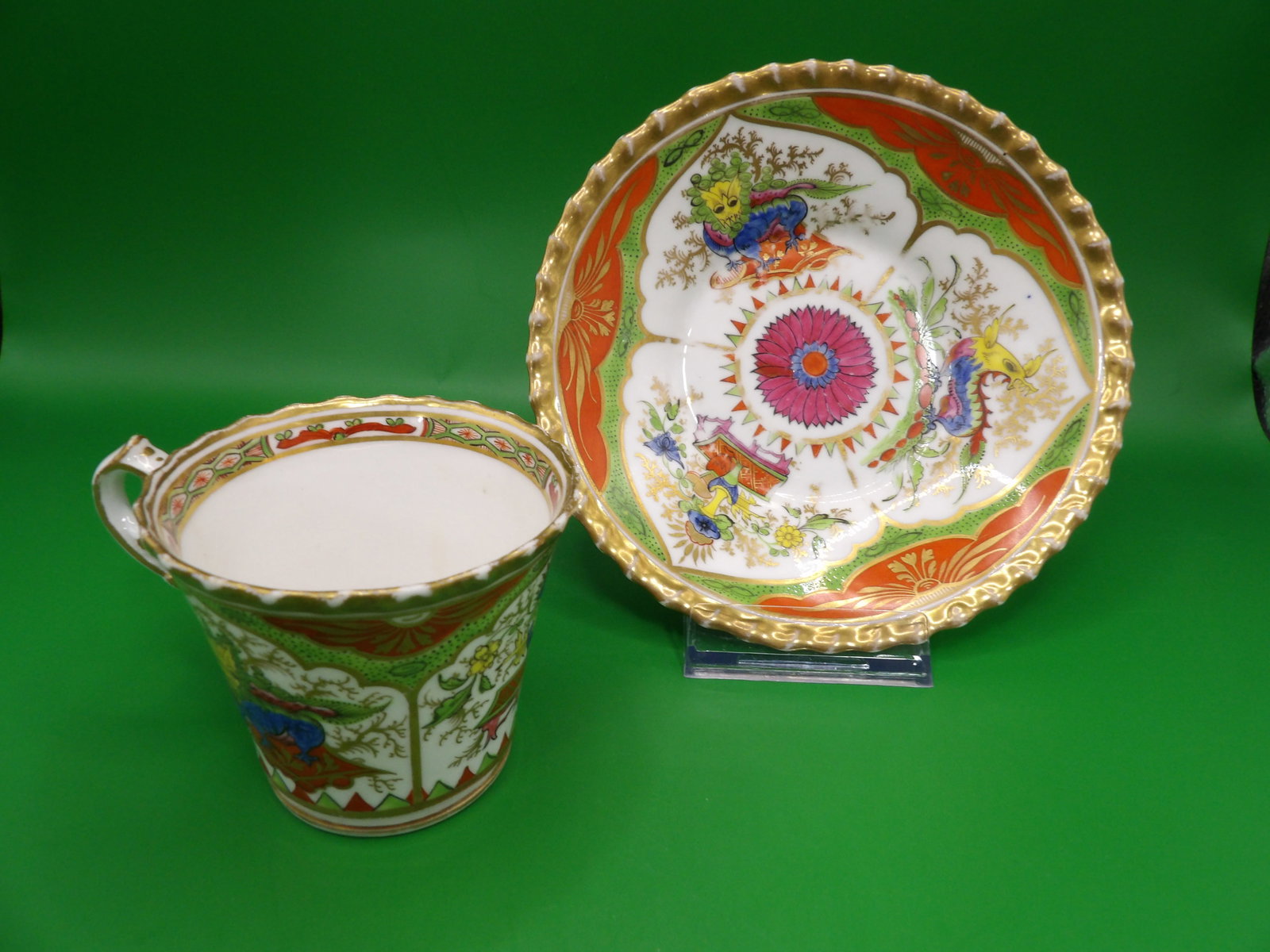 Lot of 2 circa 1820 Chamberlain's Worcester Kylin pattern porcelain cup and saucer: Saucer is 6 inches diameter. Cup is 2.5 inches height. The bottom of the cup is hand written history note by estate owner.