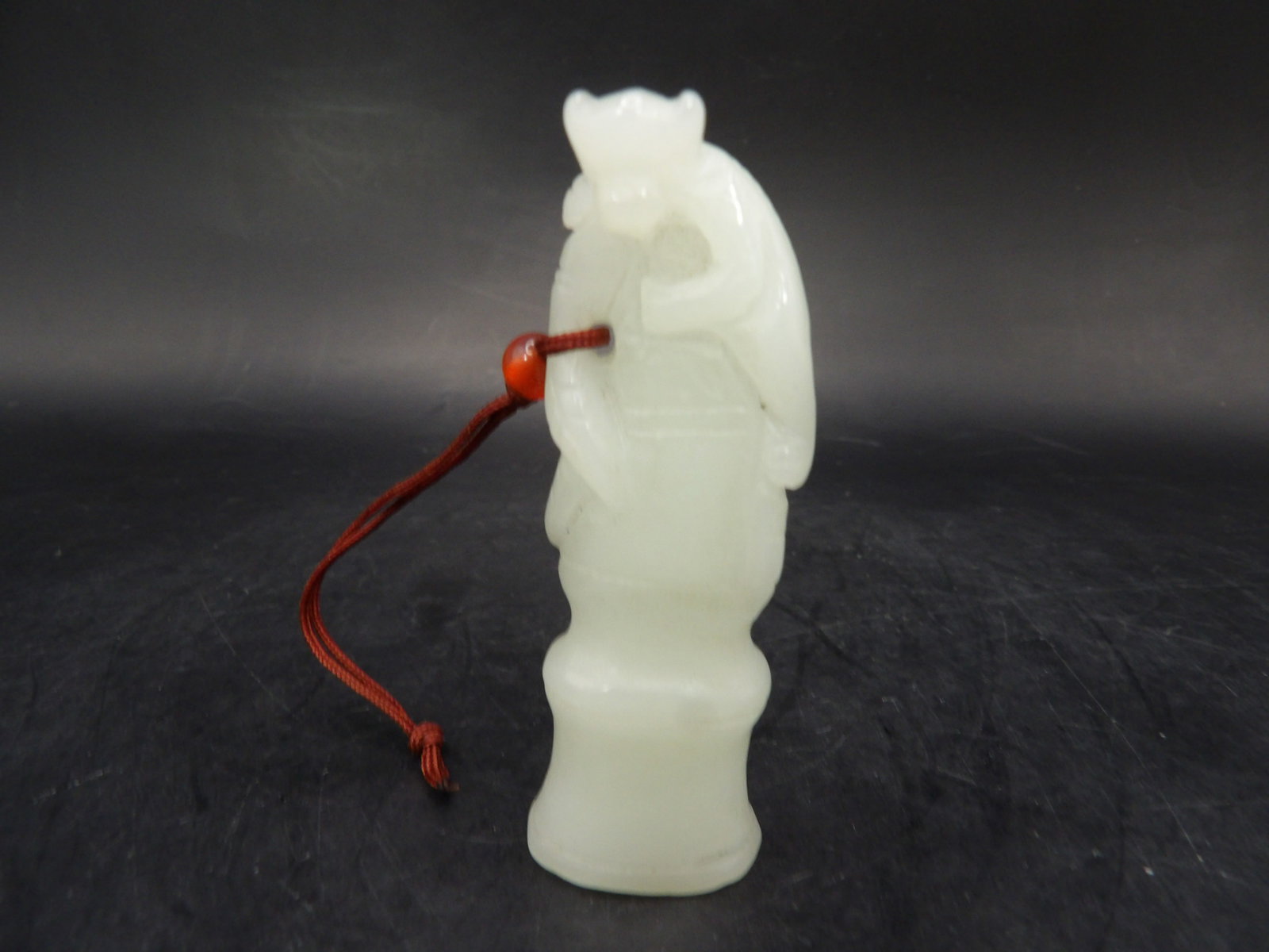 Chinese white jade carved monkey on top of tree branch (1 of 6)