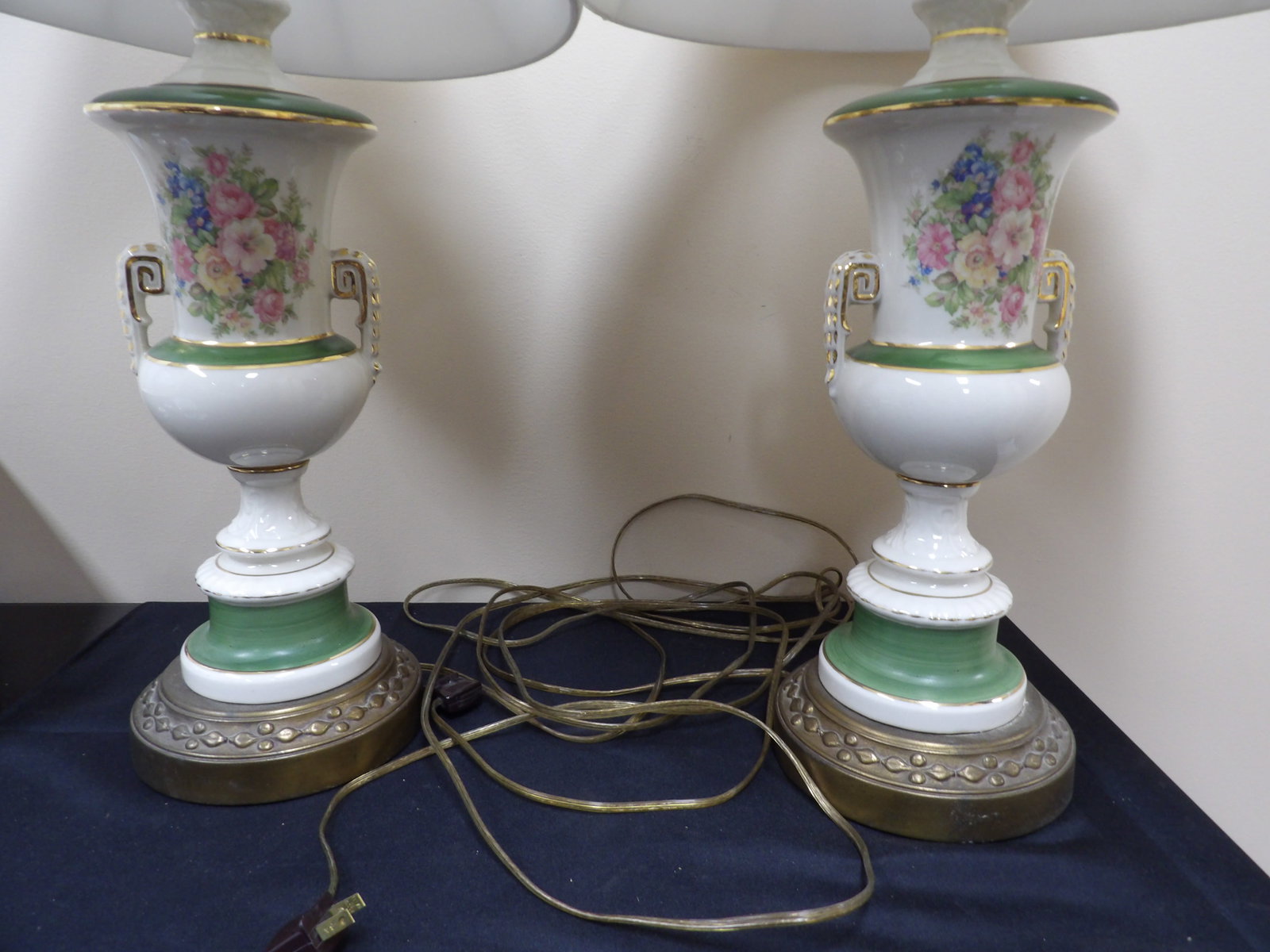 pair of porcelain urn with ears and gold gilded trims brass lamps: 31 inches height.