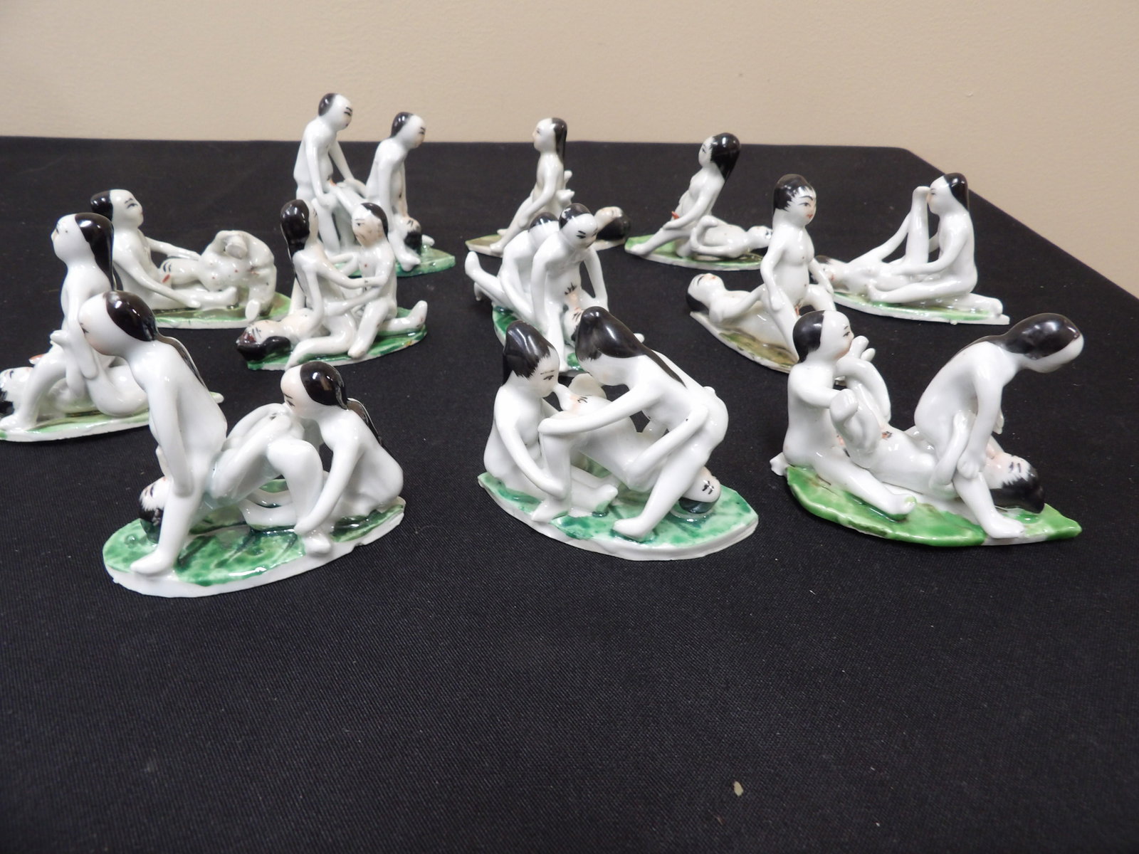 rare lot of 12 antique Chinese erotic porcelain figurines on green leaf bases: The longest one is 3.5 inches length. Lot of 12. We will inhouse ship items to you very affordable and efficient. Select self-arrange shipping.