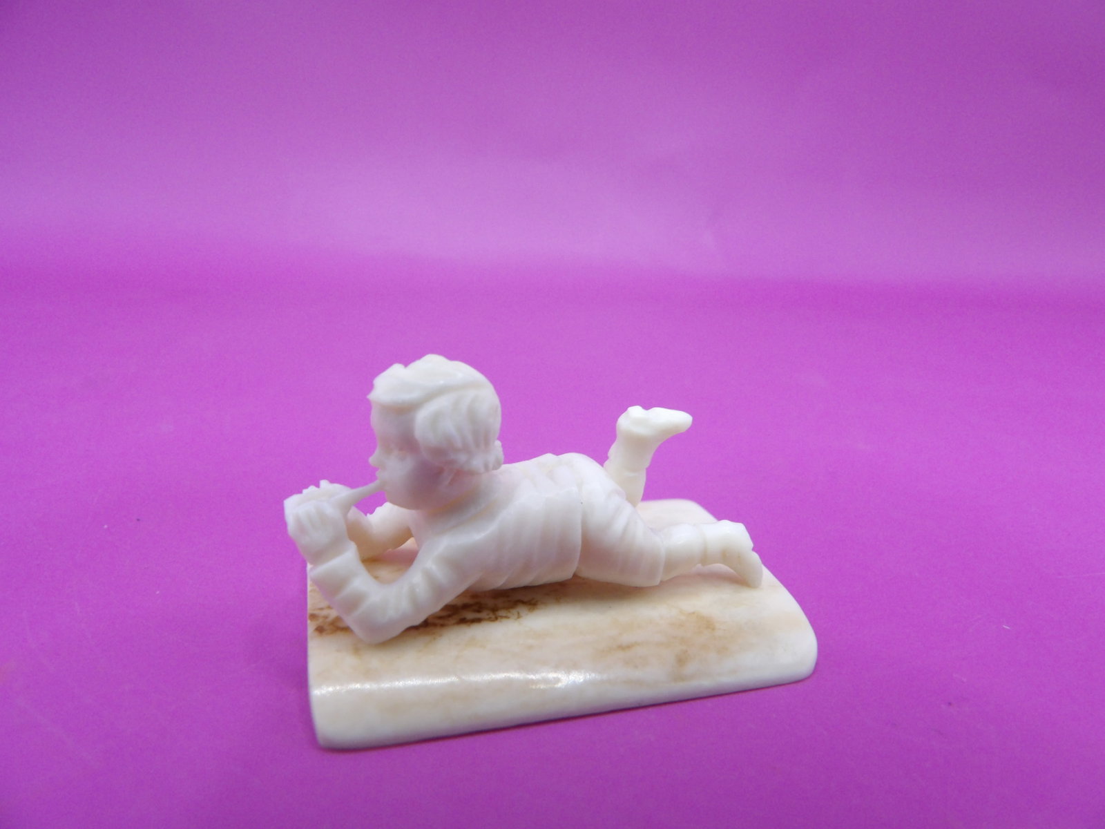 Antique fine carving of a boy lying on the floor - No Export: 1.3 inches length. Bottom has old price tag of 165. Carved of natural material. No export. We will inhouse ship items to you very affordable and efficient. Select self-arrange shipping.
