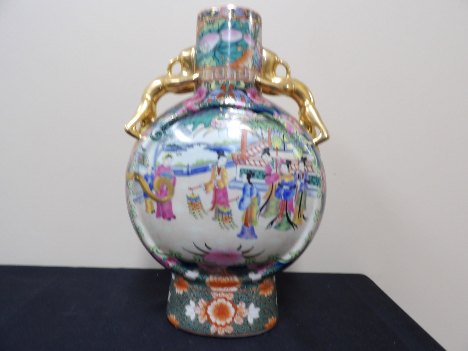 Chinese famille rose moon flask vase with dragon handles and Qing dynasty Qianlong mark: 14 inches height. We will inhouse ship items to you very affordable and efficient. Select self-arrange shipping.