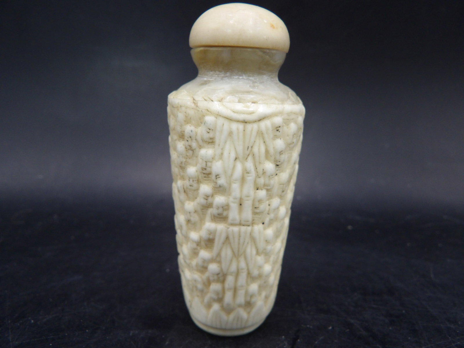 antique Chinese carved bone snuff bottle with many buddha faces motifs: 2.8 inches height. We will inhouse ship items to you very affordable and efficient. Select self-arrange shipping.
