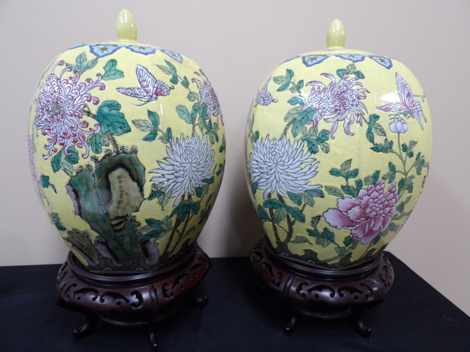Pair of fine Chinese yellow porcelain ginger jars with phoenix floral and butterfly motif: Ginger jar is approx. 12 inches height. With wooden base over 16 inches height. Probably from Republic period. We will inhouse ship items to you very affordable and efficient. Select self-arrange ship