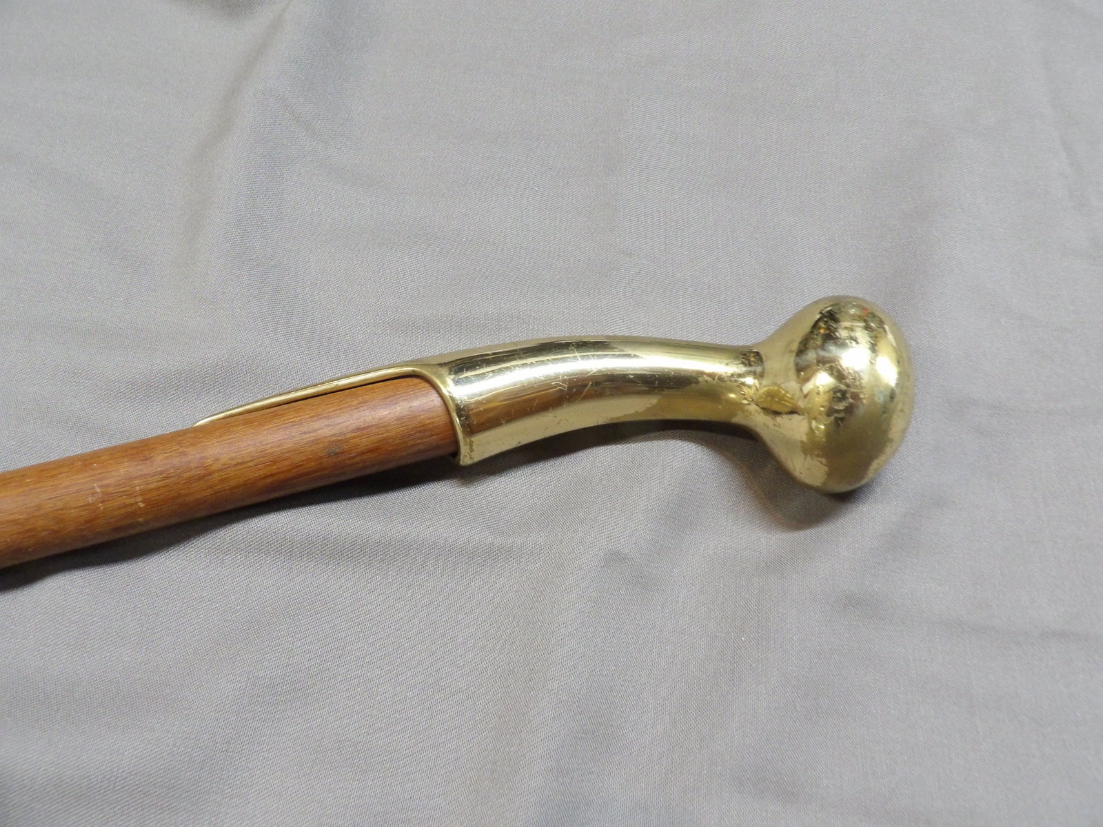 vintage walking stick cane with a brass Derby handle and wooden shaft: Brass handle is marked KRT and has scratches. 34 inches long. We will inhouse ship items to you very affordable and efficient. Select self-arrange shipping.