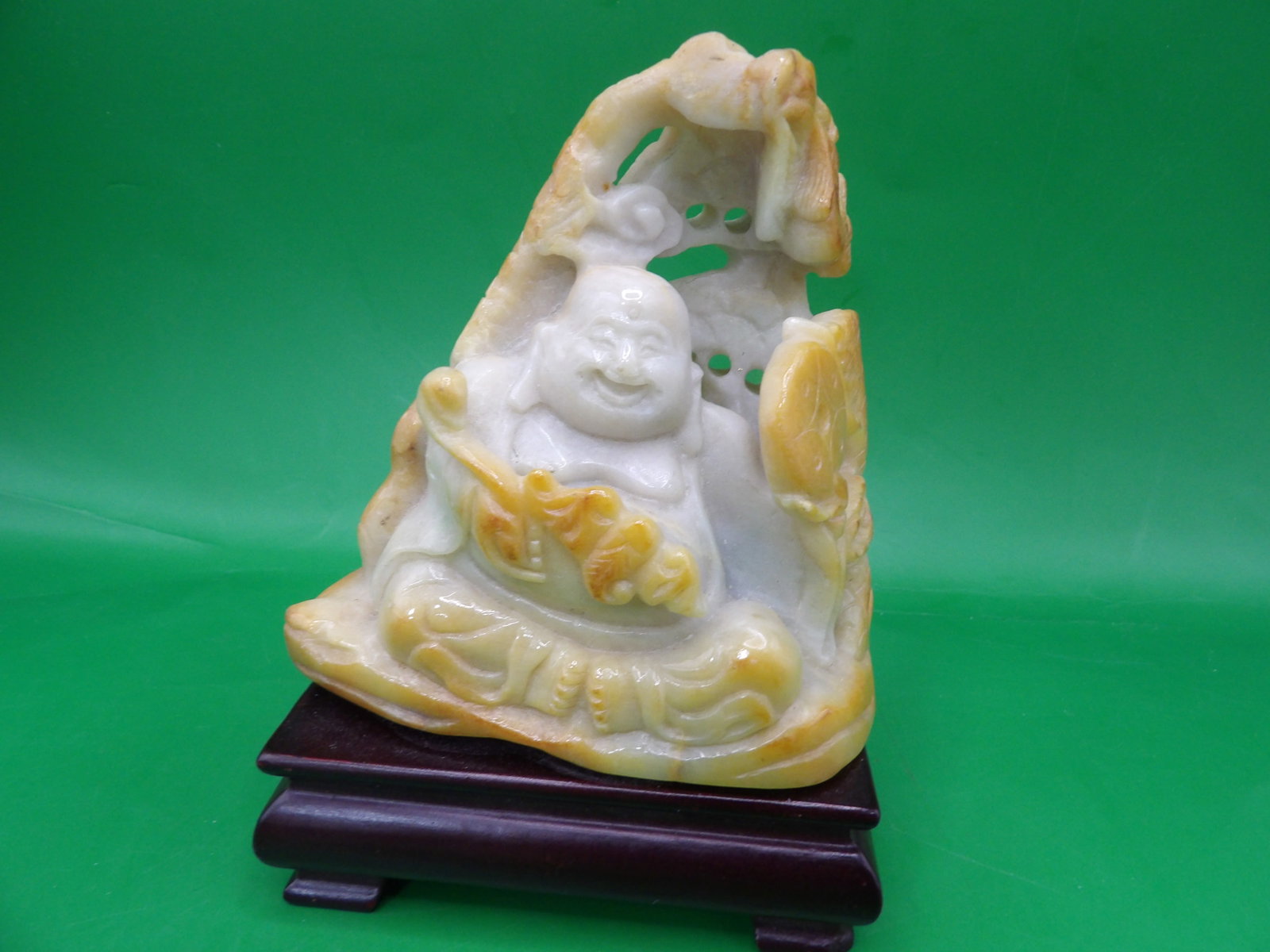Chinese jadeite jade carved buddha statue adhered to wooden base: 5.1 inches height and 551 grams including wood base.