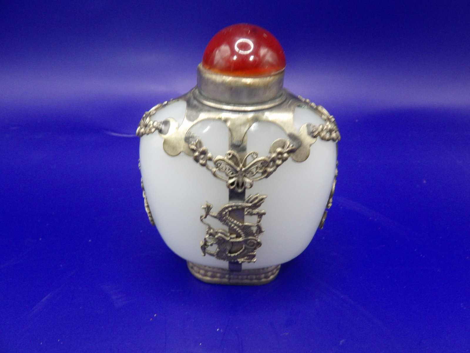 Tibetan glass snuff bottle with filigree dragon phoenix motifs: 3.2 inches height.