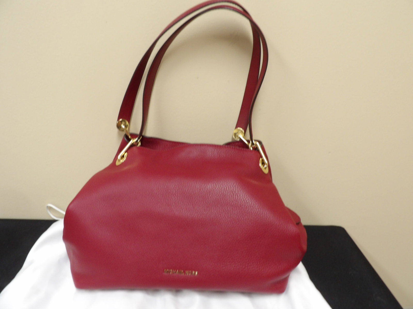 like new Michael Kors pebbled leather shoulder bag with gold hardware: 2 zipper pockets and 2 compartments. Approx size is 13 x 6.5 x 5. Barely used with dust bag.