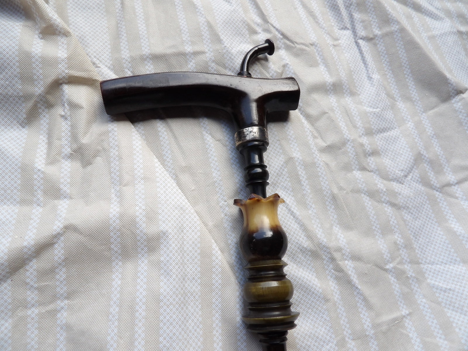 very rare antique walking cane/smoking pipe with sterling rings and pipe bowl: 40 inches long. Rings and pipe bowl are sterling silver.