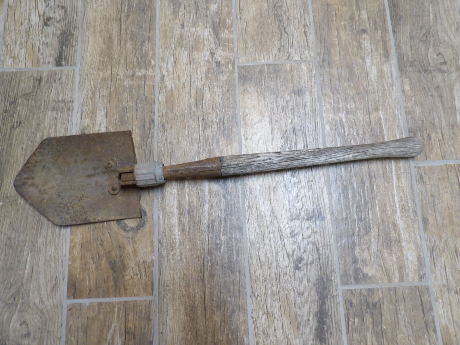 WWII US Army trench shovel with a metal head and wooden handle (1 of 6)