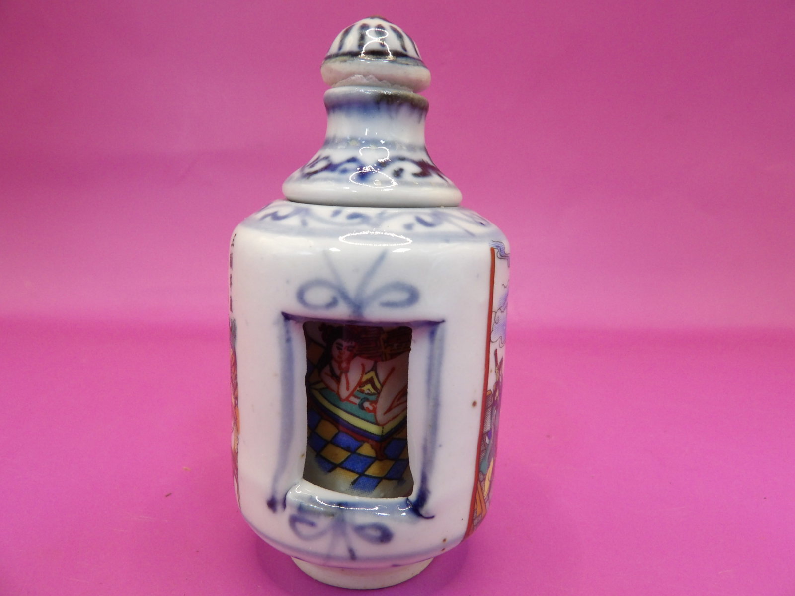 Chinese porcelain rotating snuff bottle with hand painted erotica scene inside: 3.1 inches height.