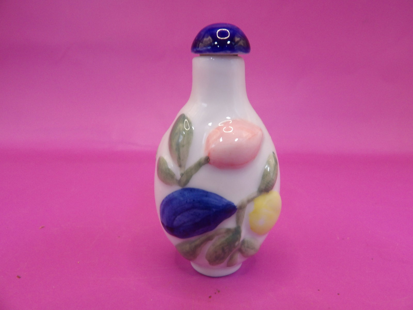 Chinese porcelain snuff bottle with raised floral motif and Qing dynasty Qianlong mark: 2.2 inches height.