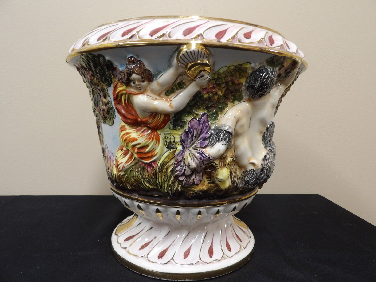 antique Capodimonte porcelain urn with mythological relief and gilded accents: Believed to be from late 19th century. Approx size is 11 x 11 x 10 inches.