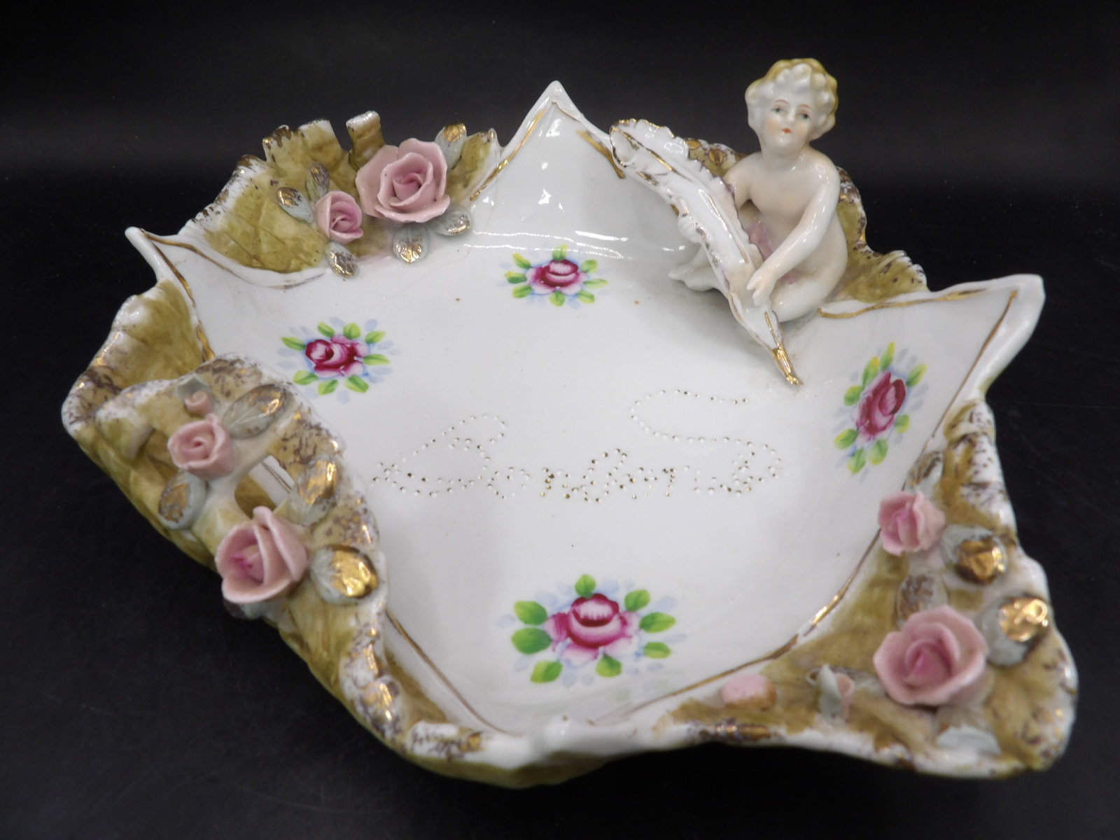 antique Rococo porcelain dish with cherub and pink roses: 7.5 inches length. We will inhouse ship items to you very affordable and efficient. Select self-arrange shipping.