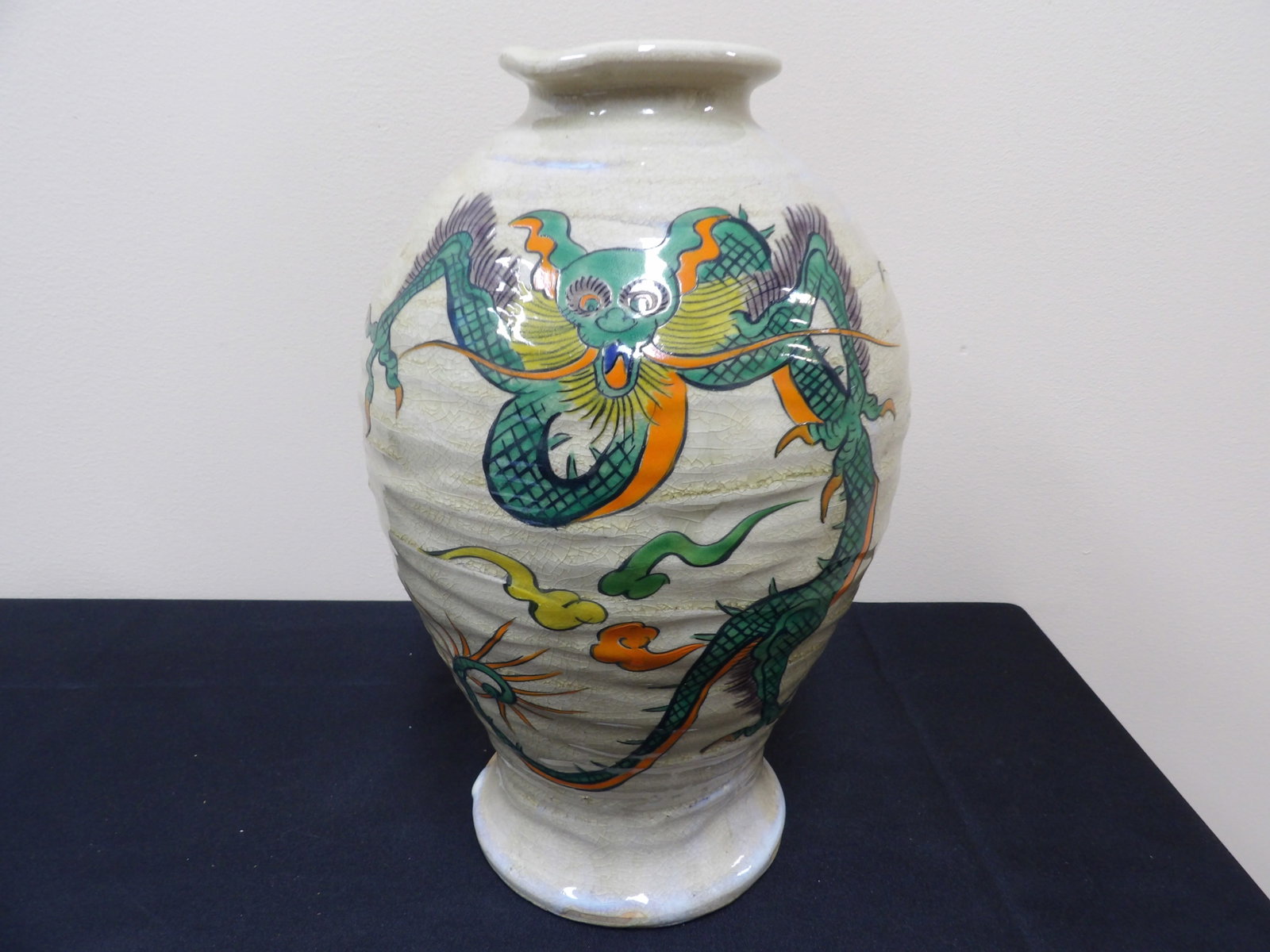 Chinese porcelain vase with dragon motif: 12 inches height. We will inhouse ship items to you very affordable and efficient. Select self-arrange shipping.