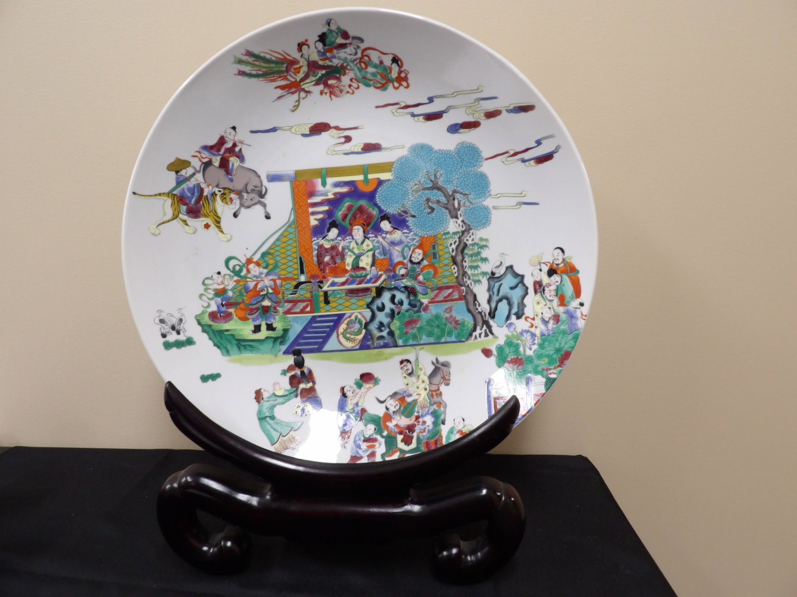 large Chinese porcelain charger plate with multiple hand painted scenes: Approx. 18 inches diameter. Wooden base is for display only and not included. We will inhouse ship items to you very affordable and efficient. Select self-arrange shipping.