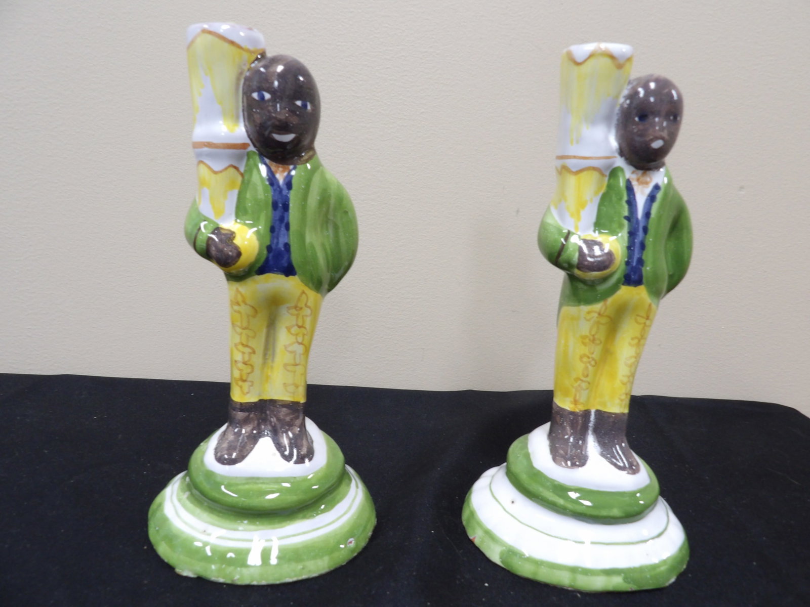 pair of made in Portugal hand painted ceramic figures serving as candlesticks: 8.2 inches height.
