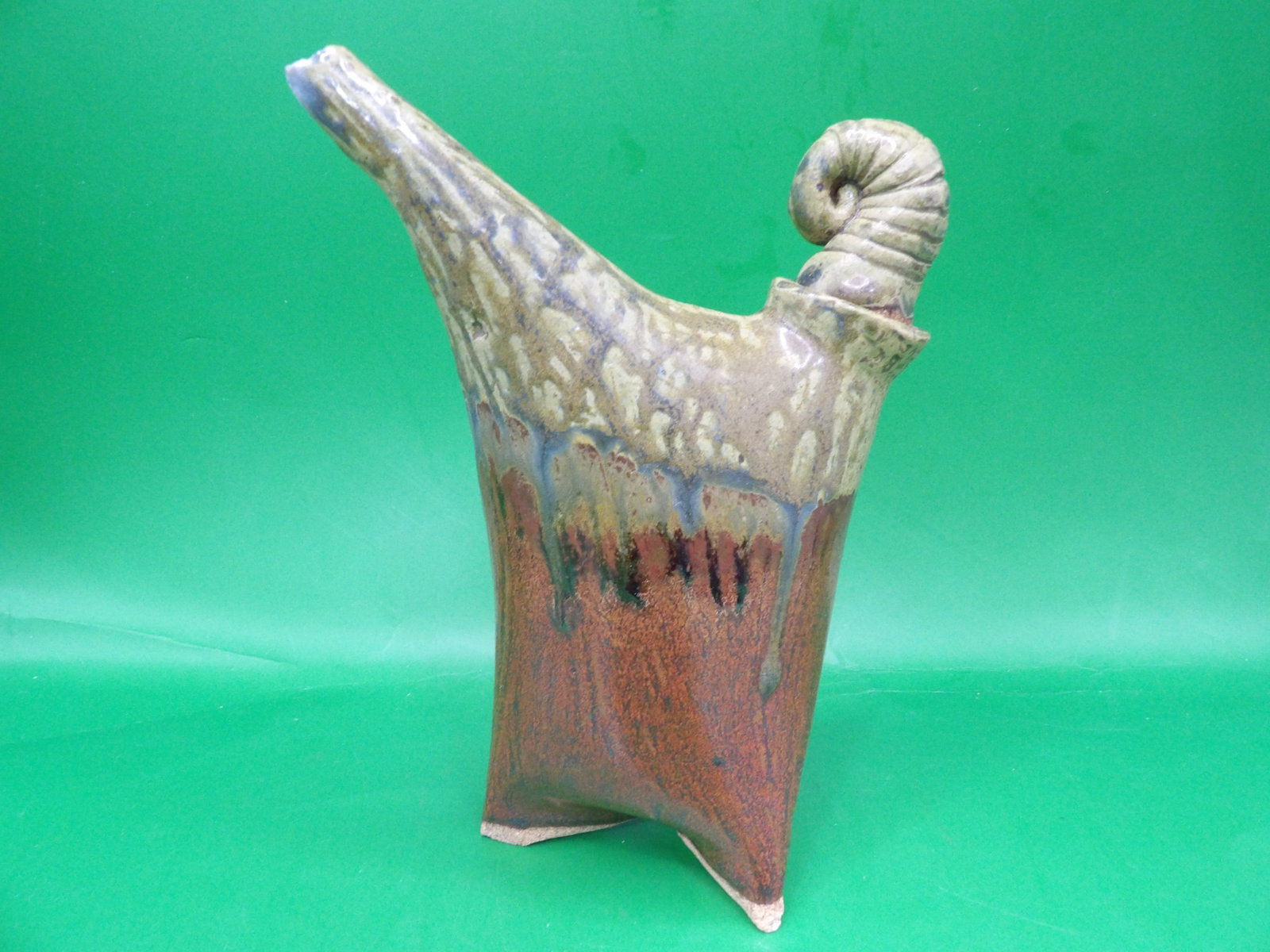stoneware pitcher with unique dripping glaze and coiled handle: 6.5 inches height.