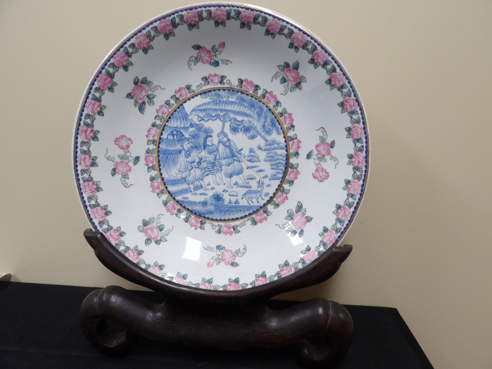 estate large porcelain charger with European subjects and custom wooden base: Porcelain charger is approx 16 inches diameter. With wooden base it's over 20 inches height. We will inhouse ship items to you very affordable and efficient. Select self-arrange shipping.