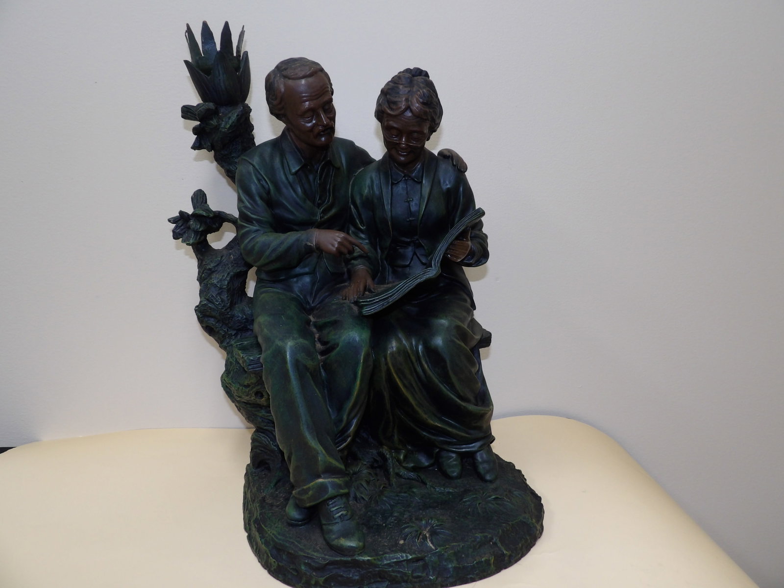 Bronze sculpture of grandparents reading a book: 16 inches height. This was original a table lamp. We will inhouse ship items to you very affordable and efficient. Select self-arrange shipping.
