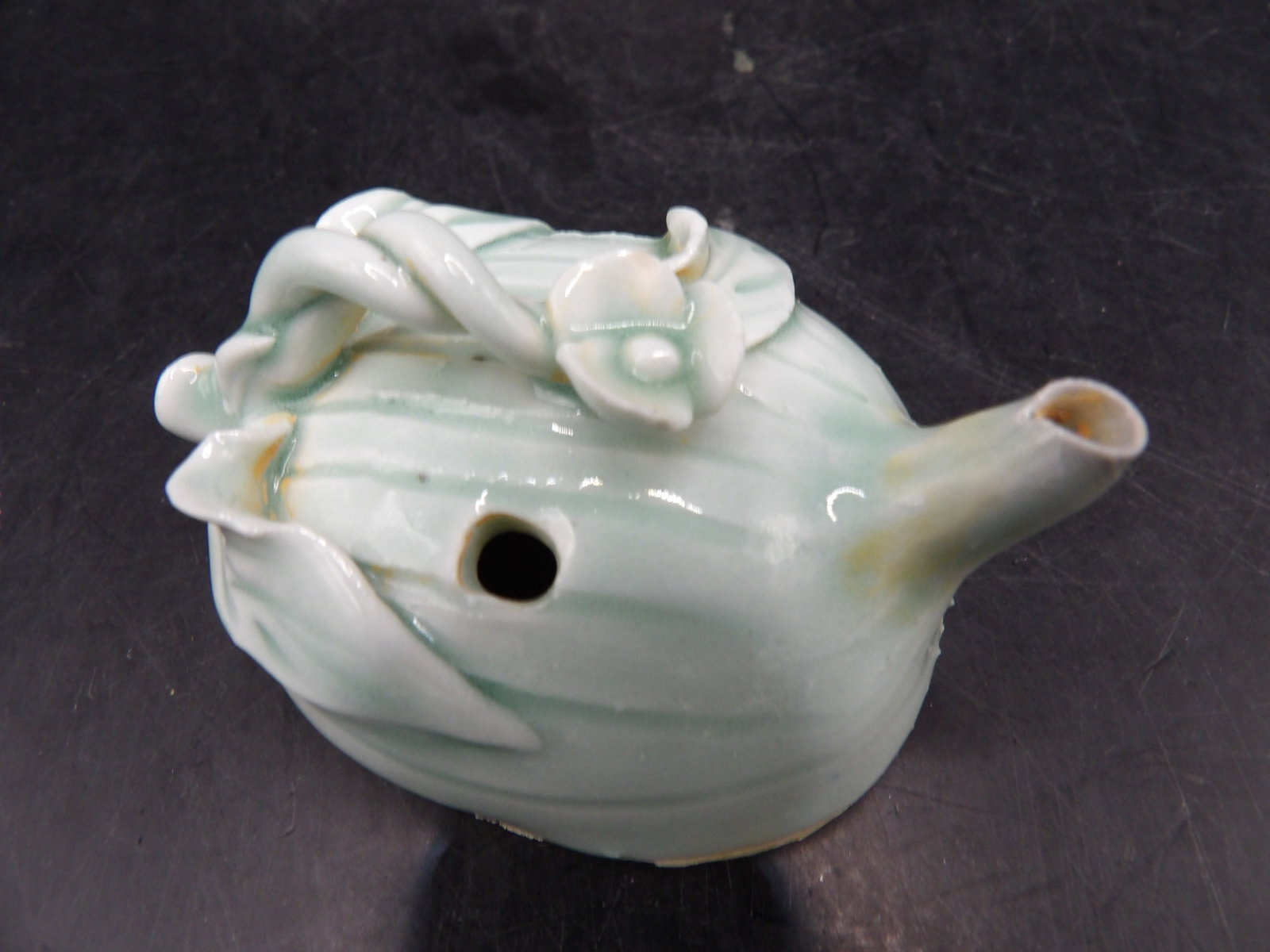 Chinese celadon porcelain water dropper with raised lotus and leaf motifs: 2.5 inches length. We will inhouse ship items to you very affordable and efficient. Select self-arrange shipping.
