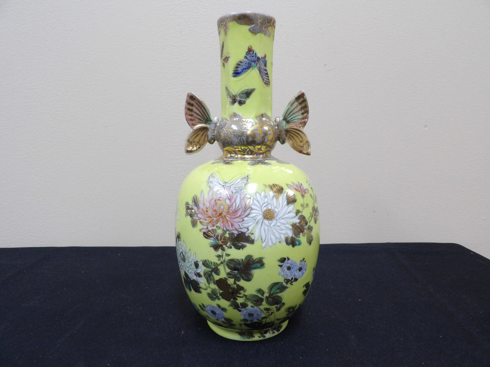 fine Japanese floral porcelain vase with butterfly handles signed: Approx.10 inches height.