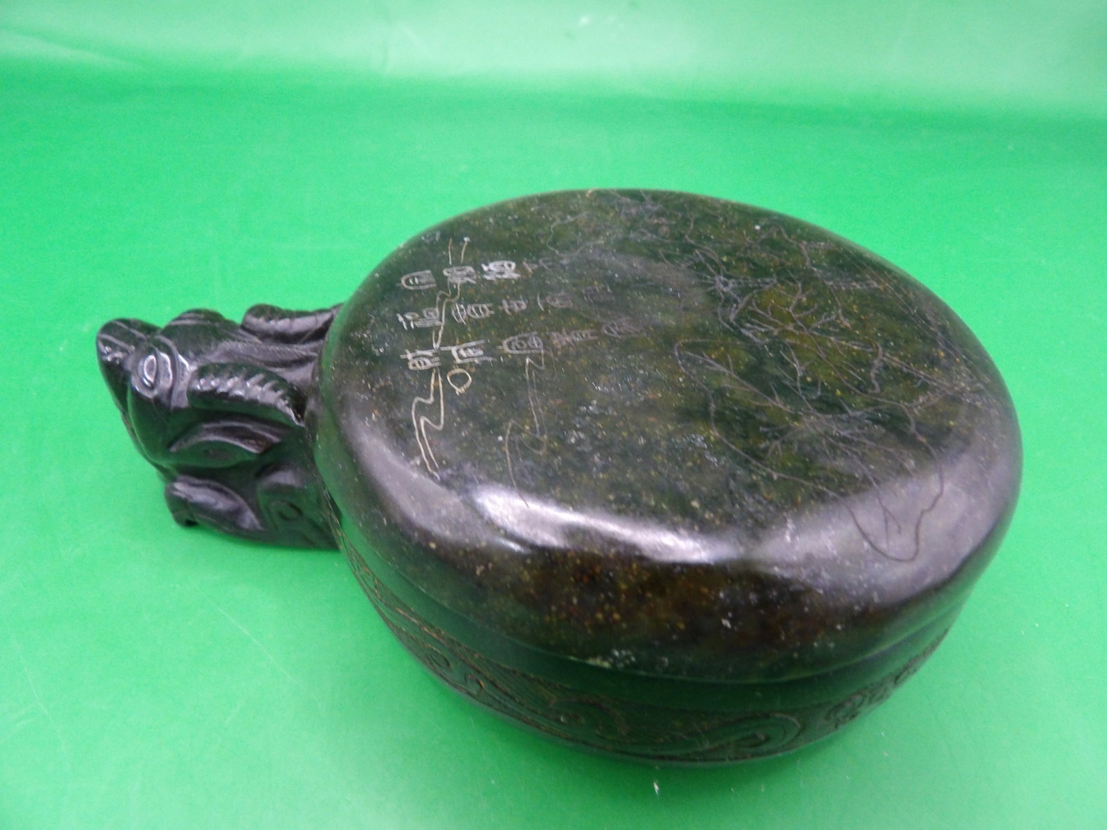 Chinese jade carved lidded box with dragon motif and Chinese calligraphy: 4.5 inches length. 346 grams.