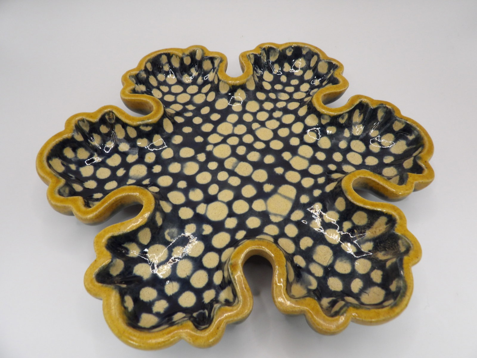 Chinese porcelain plate with scalloped edges: 9 inches length.