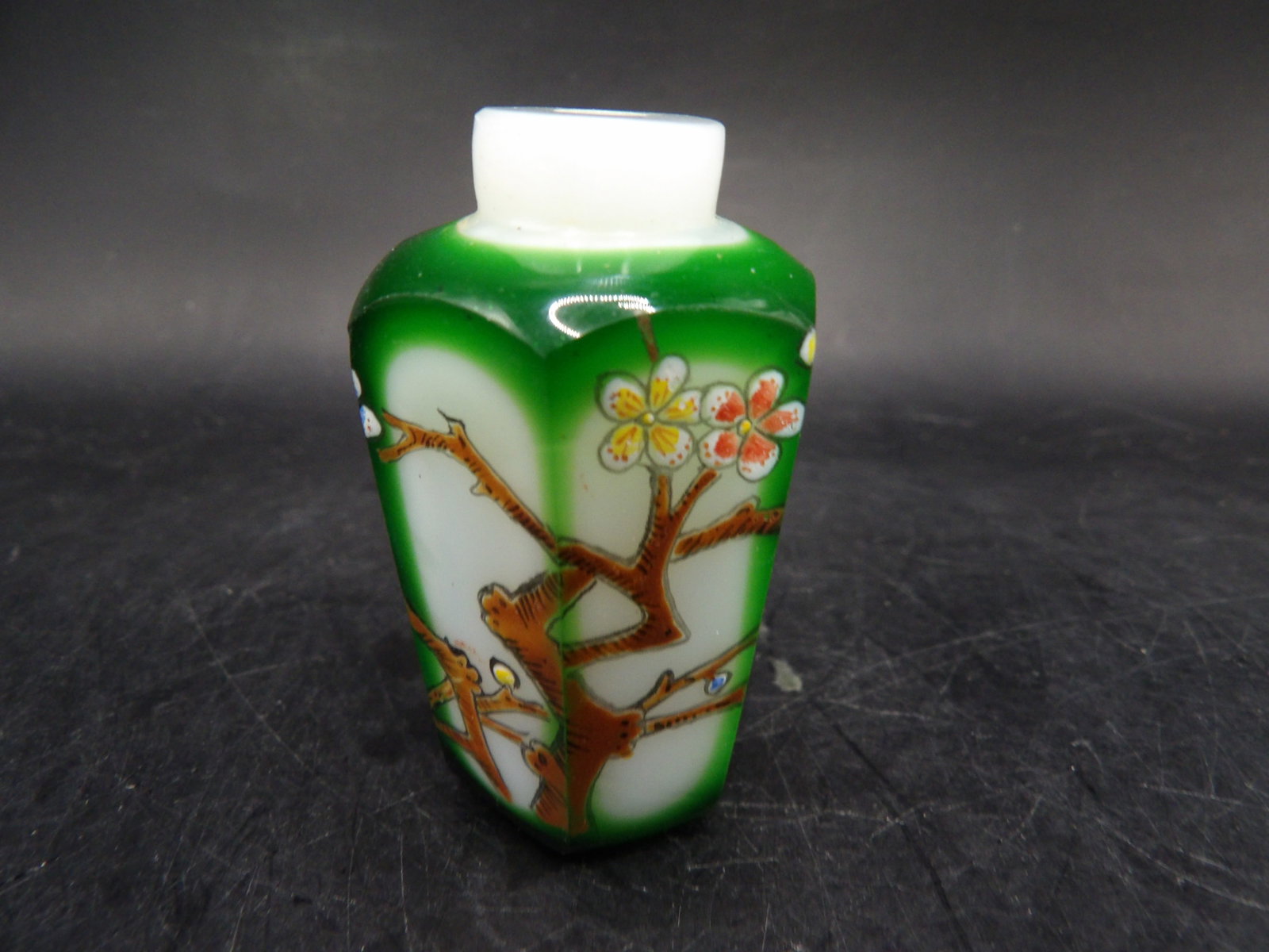 Chinese glass hexagon shaped snuff bottle with floral and tree motifs: 2.2 inches height.