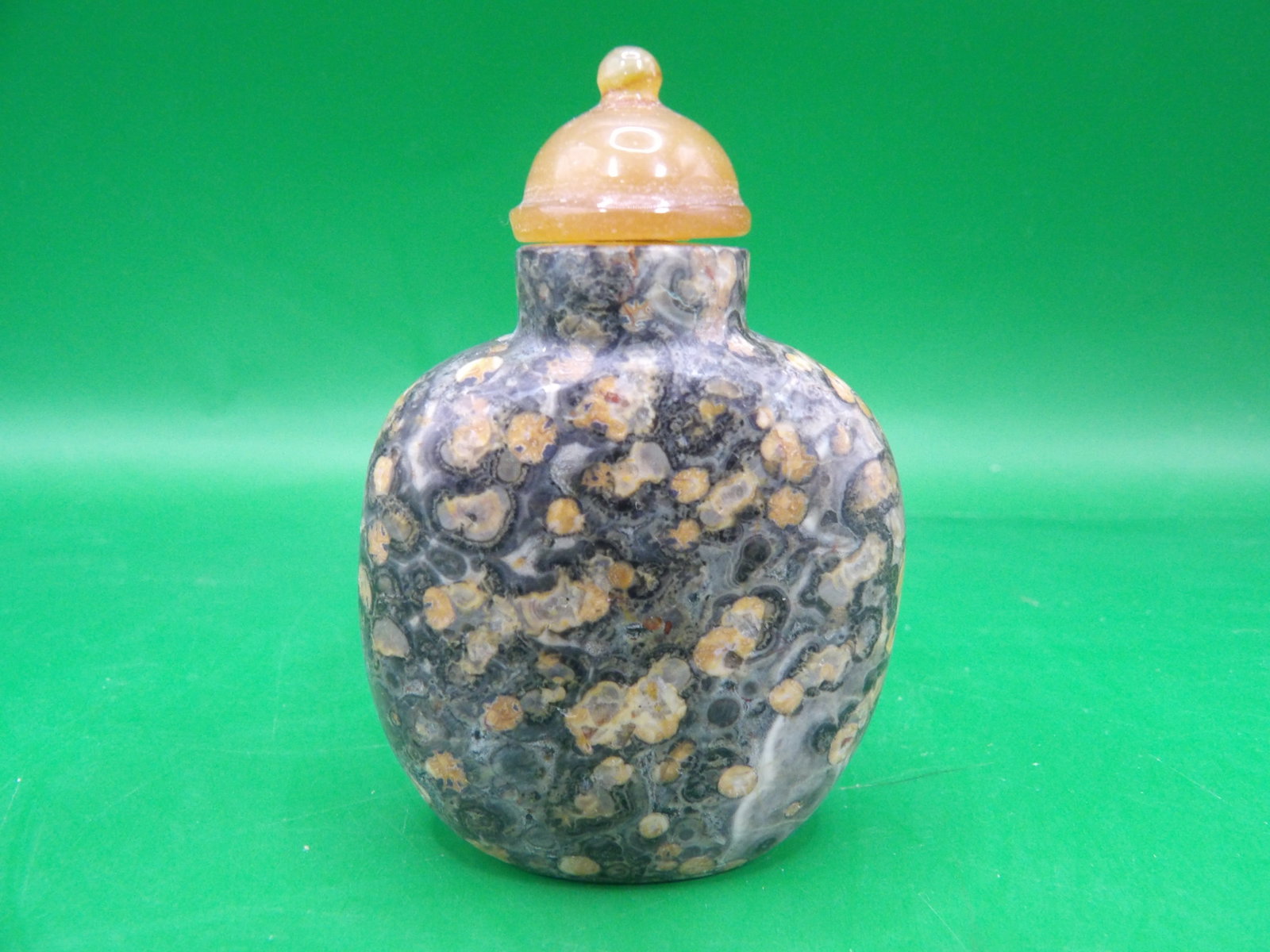 Chinese carved pudding stone snuff bottle (1 of 5)