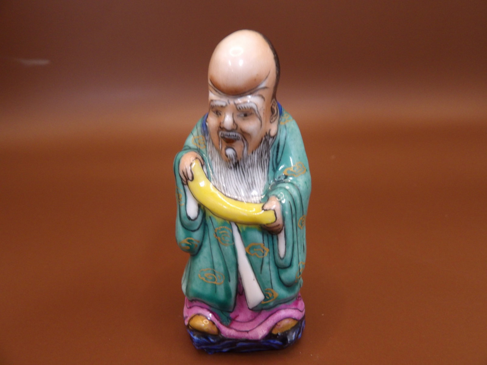 Chinese molded porcelain snuff bottle depicting Longevity God with Qing dynasty Qianlong mark: 2.5 inches height.