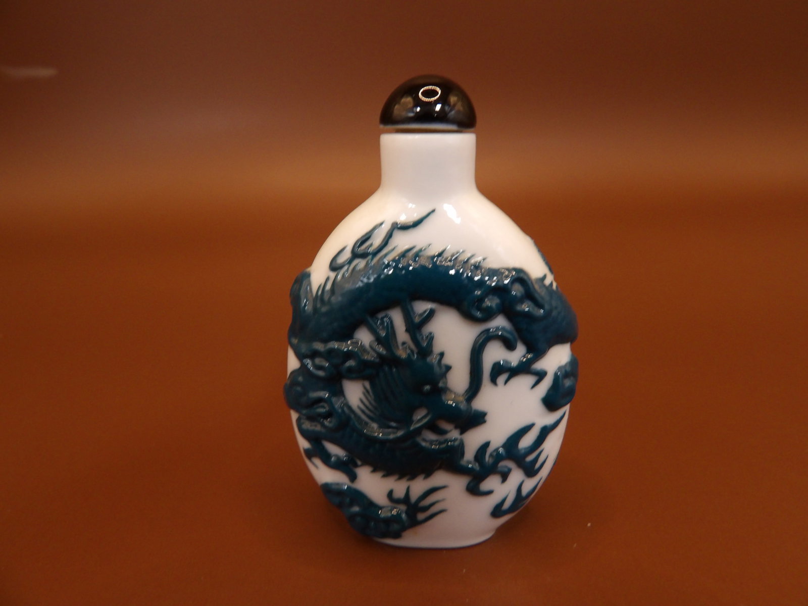 Chinese porcelain snuff bottle with raised dragon motif: 2.1 inches height.