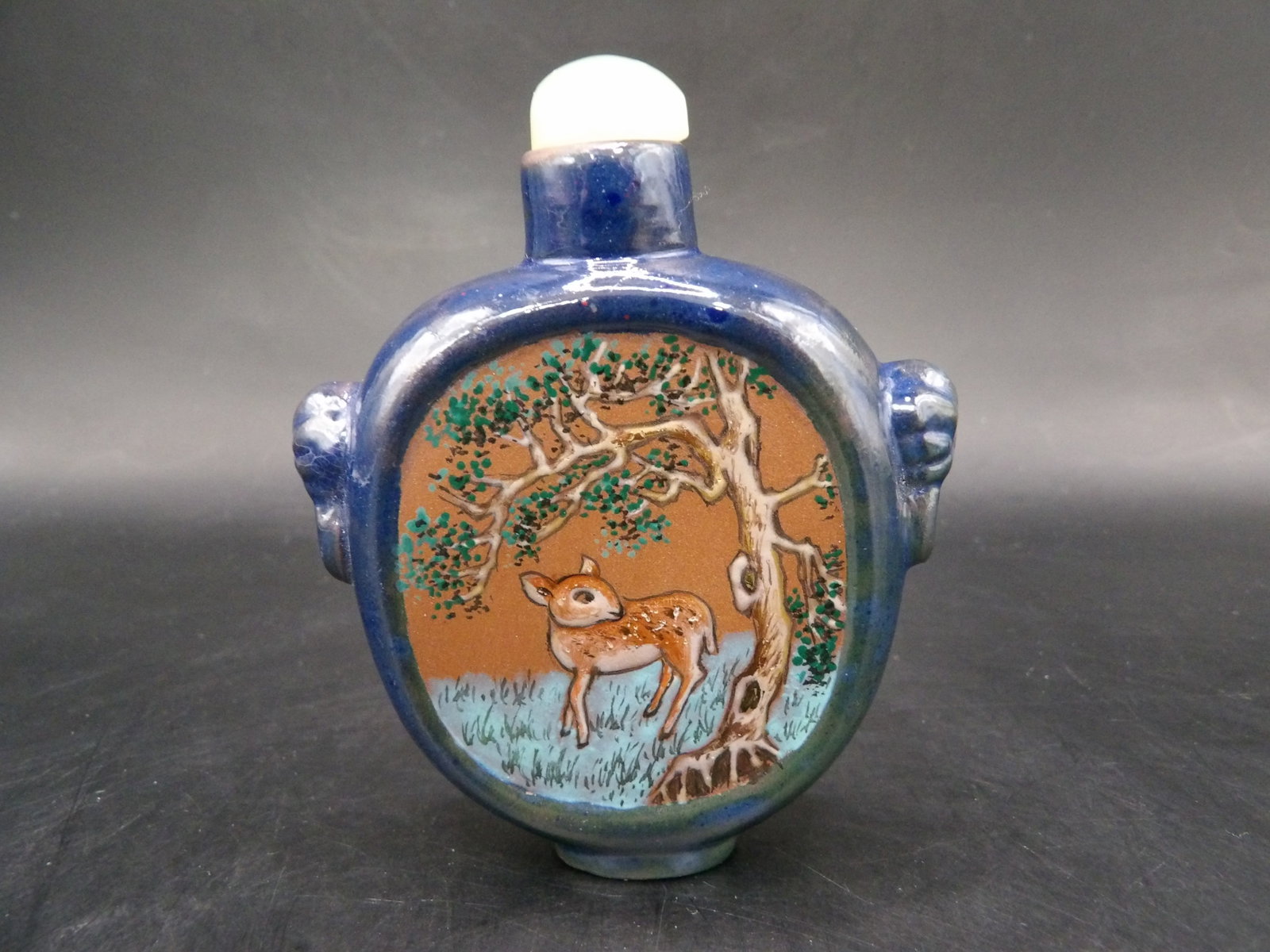 rare Chinese Yixing enamel painted snuff bottle with deer motif and lion heads: 2.8 inches height.