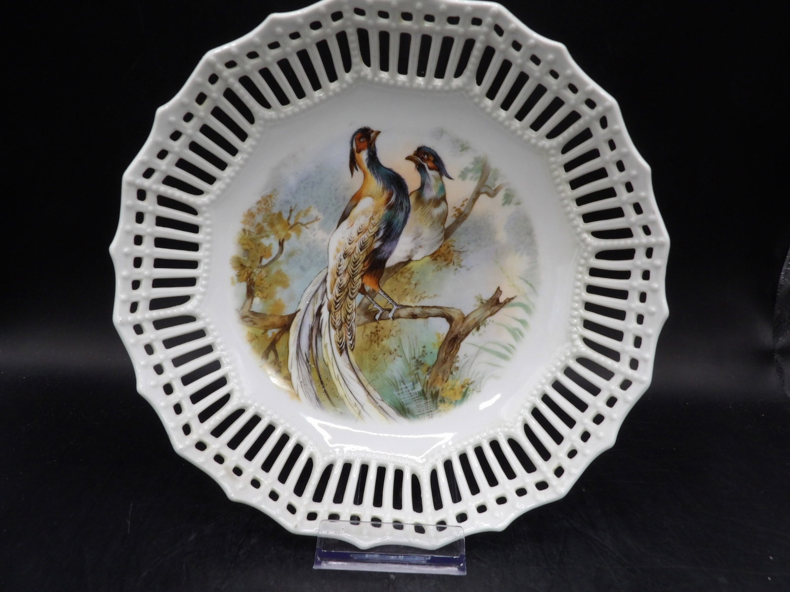 antique German reticulated bowl featuring birds on a branch: 8.5 inches diameter.