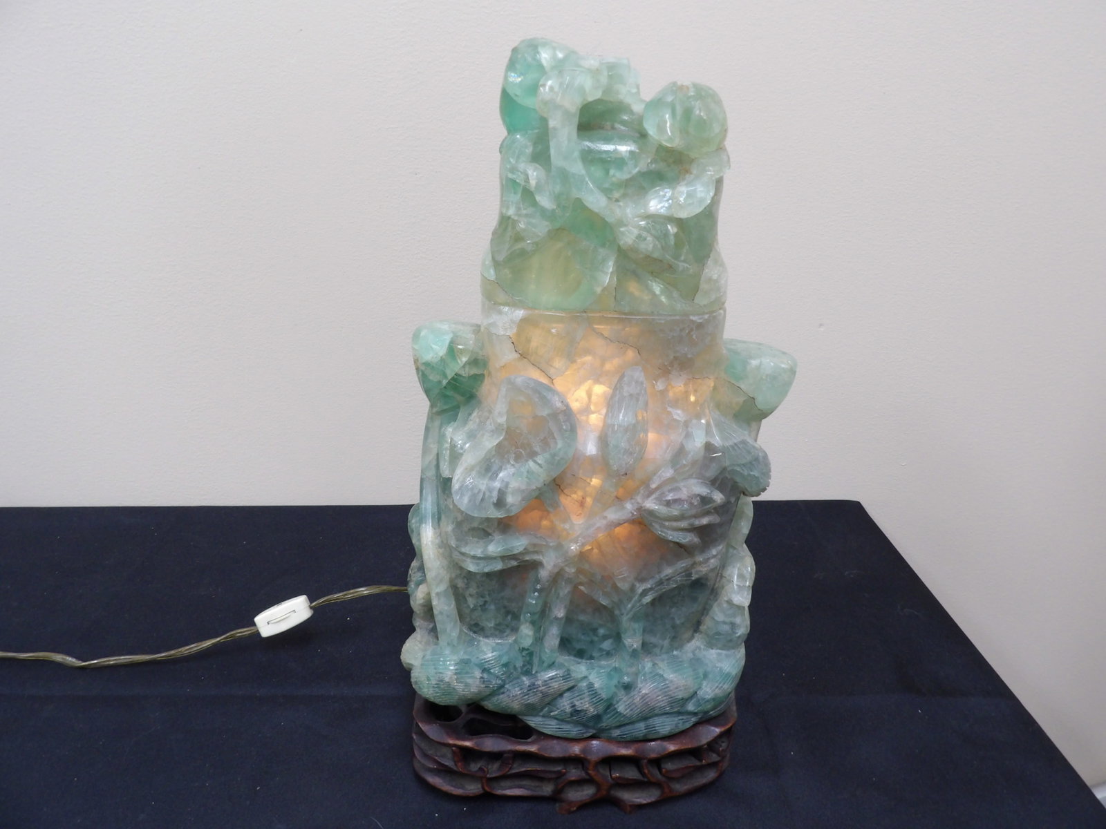 Over 19 lbs Chinese hand carved fluorite lamp with lotus motifs on wood base: Approx. 15 inches height. 19 lbs 11 oz.